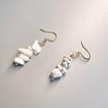 Macro detail of Bohemian white marble stone beaded earrings with gold metal hooks - White Turquoise