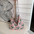 Detail of floral canvas tote bag showing pink flower pattern and large shoulder strap - Pink Hibiscus