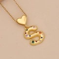 Close-up of golden snake pendant necklace featuring vibrant multi-color zircon stones - S / Gold
