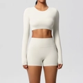 Detail view of the seamless high-stretch fabric and knit texture of the yoga workout set - S / Top And Bottom / Light Ivory