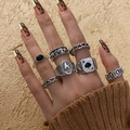 Detailed close-up of gothic skull and bat rings on hand with leopard print nails - 05 Antique Silver 11459 (7pcs Set)