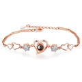 Rose gold heart projection bracelet featuring cubic zirconia stones and link chain - Rose Gold