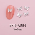 Macro view of silver alloy butterfly nail charms with rhinestones and size label - Silver Mini Butterfly (AD84)