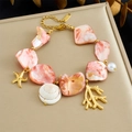 Pulsera bohemia de acero inoxidable con piedras rosas, estrella de mar y conchas - Pulsera Estilo Océano (B1742)