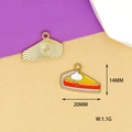 Detail of slice cake enamel pendant with gold trim showing front and back textures - Pumpkin Pie