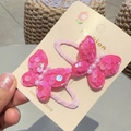 Detail of pink sequin butterfly hair clips with pearl center and fabric covered grips - Rose Red BB Clip (Pair)