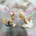 Macro shot of 18K gold plated crown pendants featuring abalone and white shell inlay - Three-Drill Crown Abalone Shell