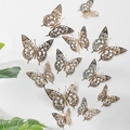 Detailed view of 3D cutout gold and silver butterfly wall stickers in varied sizes - Champagne