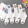 White cotton athletic crew socks featuring trendy street style graphic prints and patterns - Optional National Trend Socks