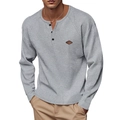 Close-up of grey waffle knit Henley shirt with buttons and decorative chest patch - S / Tops / Light Gray