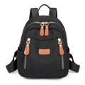 Mochila de nailon negro para mujer con detalles de cuero marrón y varios bolsillos - Negro