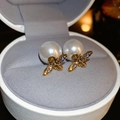 Detail of bee earrings with pearls and crystal inlay on a minimalist jewelry box - Golden Bee Pearl (Silver Needle)