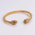 Two-tone twisted cable wire bracelet with gold-plated metal caps in a minimalist design - Gold