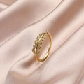 Elegant gold leaf ring with zircon stones on a champagne silk fabric background - Leaf Wheat Ear (Model E)