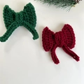 Handmade crochet Christmas bows in red and green yarn for festive tree decoration - Red Bow
