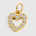 Detailed close-up of a heart-shaped gold pendant with sparkling pavé zircons and metal ring - Heart