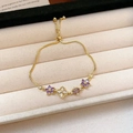 Adjustable gold bracelet with purple and white zircon flower charms on velvet - Gold Purple Flower