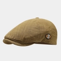 Detailed view of the brown plaid texture and the 'm' logo on the vintage flat cap - One Size / Khaki
