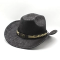 Detail of black vintage cowboy hat featuring cracked texture and bronze bull head emblem - M (56-58cm) / Black Flat Top