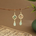 Detail of fan-shaped bamboo leaf earrings with green tassels and jade-like drops - Asymmetric Enamel Flower (E6451)