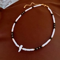 Baroque freshwater pearl necklace featuring black and white beads with a golden clasp - White Black Freshwater Pearl Shell Necklace (#37)