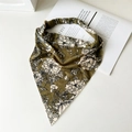 Detailed flat lay of olive green cotton floral headscarf with elastic band on white background - Grass Green Floral