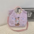 Quilted light purple crossbody bag featuring cute cartoon dog embroidery and woven handles - Music Dog Purple