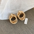 Detail of gold multilayered irregular hoop earrings featuring matte and polished textures - Iron (925 Silver Pin) / Gold