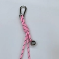 Pink woven rope keychain with a silver bell and durable metal carabiner clip - Pink