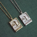 Vintage gold and silver rectangular moon star shell pendants on green texture background - Moon / Gold
