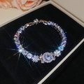 Detail shot of a silver zircon flower bracelet displayed in a premium black jewelry box - Bracelet-White Flower