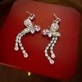 Detail shot of silver butterfly earrings with pink zircon stones and long tassels - Pink Butterfly Tassel Earrings with Silver Pin