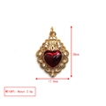 Detailed view of red heart pendant with gold filigree and dimensions 28mm by 17.5mm - Hollow Sacred Heart