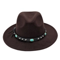 Close-up of leather band with turquoise stones and metal studs on a felt cowboy hat - Coffee