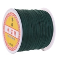 Dark green 72 gauge jade cord roll for jewelry making on a white plastic spool - Dark Green
