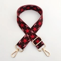 Detail of adjustable star pattern woven bag strap with golden metal swivel hooks - Coffee Base Red Star Gold Buckle