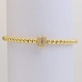Detail of gold bubble letter U charm with micro-pave cubic zirconia on beaded bracelet - Letter U
