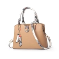 Khaki synthetic leather handbag with plaid straps and a heart pendant on white background - Khaki