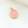 Detailed view of round gold star pendant with pink enamel inlay on textured fabric - Pink Enamel Star Round Charm