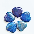 Set of five polished heart-shaped lapis lazuli stones with gold flecks on white background - Lapis Lazuli