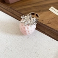 Detailed top view of a pink flocked strawberry ring with an adjustable silver band - Pink Strawberry Ring