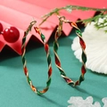 Detail of Christmas hoop earrings with red green and gold spiral enamel design - Red Green in KC Gold