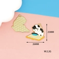 Cat reading on books enamel charm in black and white finish with gold back - Cat Reading with Magnifying Glass