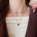Collier double rang œil de tigre avec perles brunes et chaîne dorée sur mannequin - 20# Style Superposé Perles Colorées et Pierre Précieuse Ovale
