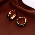 Detail of wide gold-plated metal hoop earrings with black enamel inlay and engraved logo - Black C-Shape Ear Buckle (Genuine Gold Plated)