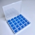 25 Blue Bobbins In A 25-compartment Box / Shuttle Core Storage Box