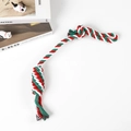 Macro detail of red, green and white braided cotton rope dog toy with ball and loop knots - Christmas Carry Rope 45cm (80g)