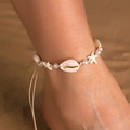 Bohemian woven anklet with starfish shells and pearls on a sandy beach background - Shell Pearl Braided Single Piece