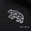Macro shot of silver geometric bear pendant with dimensions 41.9x24 mm on dark background - Geometric Bear