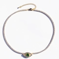 Detail van de gouden tennisketting met groene zirkoon boze oog hanger van dichtbij - Groen